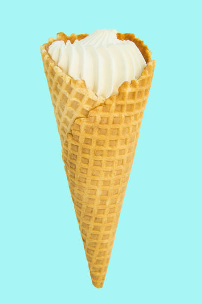 istock Vanilla ice cream in waffle cone isolated on pastel blue background, vertical close-up frame 1151737296
