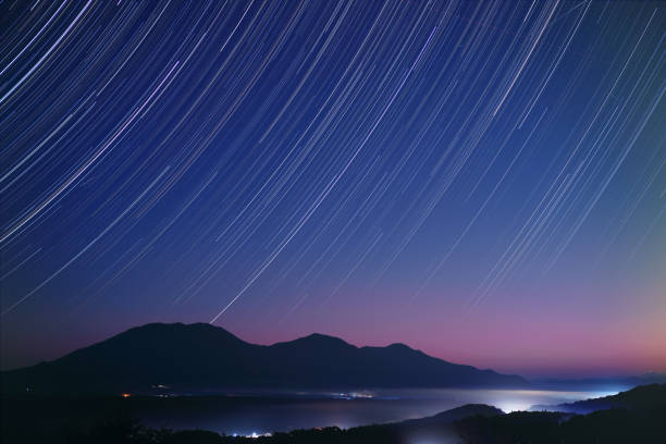 Star trails over the 3 peaks of Mt. Hiruzen in autumn Star trails over the 3 peaks of Mt. Hiruzen in autumn. The mountain is a famous sightseeing spot in Okayama, Japan. okayama prefecture stock pictures, royalty-free photos & images