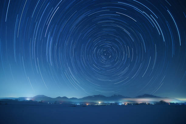 Star trails over Mt. Hiruzen and Mt. Daisen in winter Star trails over Mt. Hiruzen and Mt. Daisen in winter. These mountains are famous sightseeing spots in Chugoku district, Japan. north star stock pictures, royalty-free photos & images