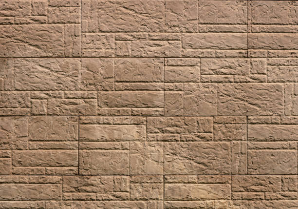 istock grunge texture beige brick wall urban background. abstract old yellow backdrop retro vintage wallpaper 1151742944