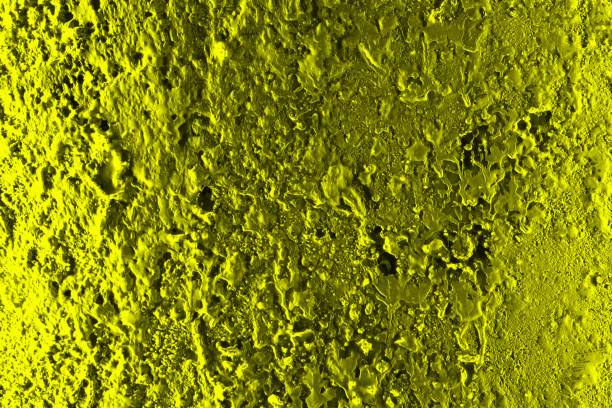 istock yellow festival style highlighted volume stucco texture - nice abstract photo background 1151743143