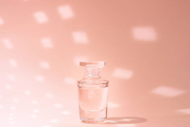 istock Fragrance in perfume bottle on pink background with copy space 1151746226