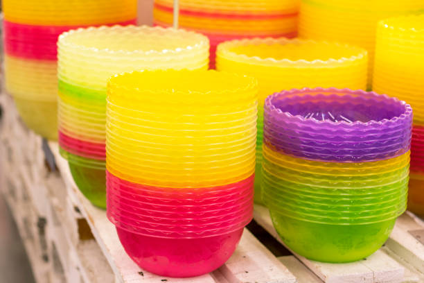 istock Plastic multi-colored bowls on the shelf in the store 1151746432