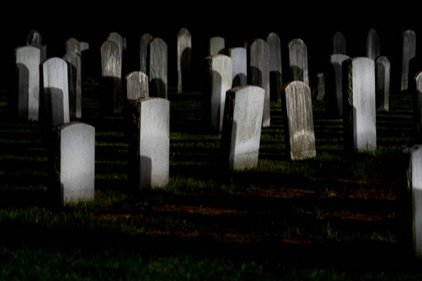 istock spooky Old usa cemetery grave yard at night 1151746814