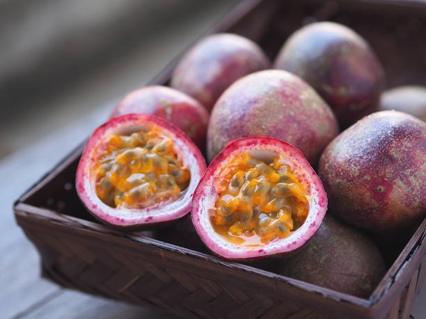 istock Passion fruit close up on wooden background. 1151748605