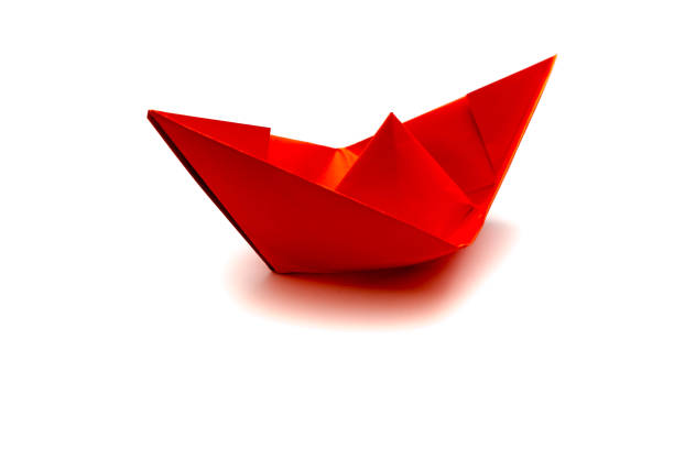 istock Red paper boat isolated on white background 1151751330