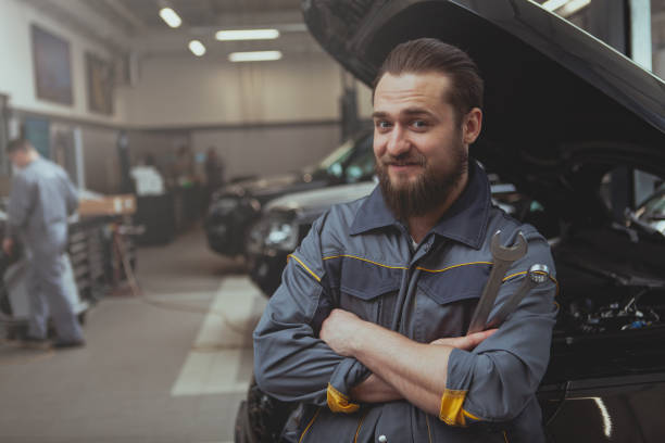 istock Car service worker repairing automobile 1151753130