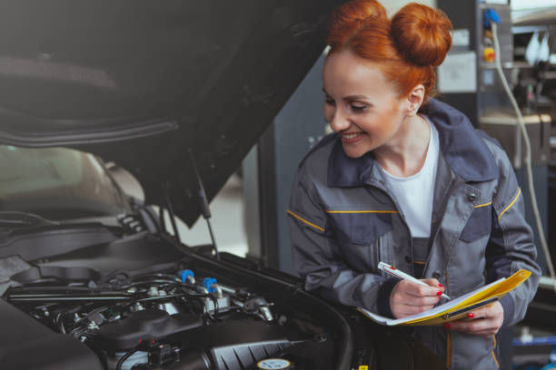 istock Car service worker repairing automobile 1151753777