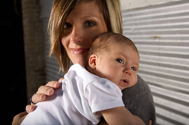 Portrait of a mother bonding with her baby daughter at home