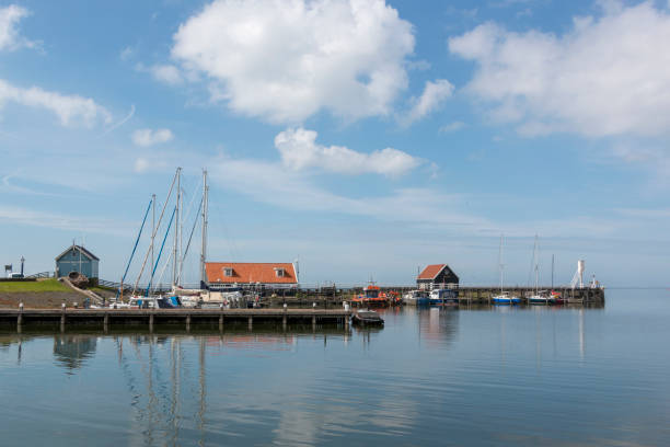 View over the harbor of Hindeloopen, historical city in the lake side district of the Netherlands. stock photo