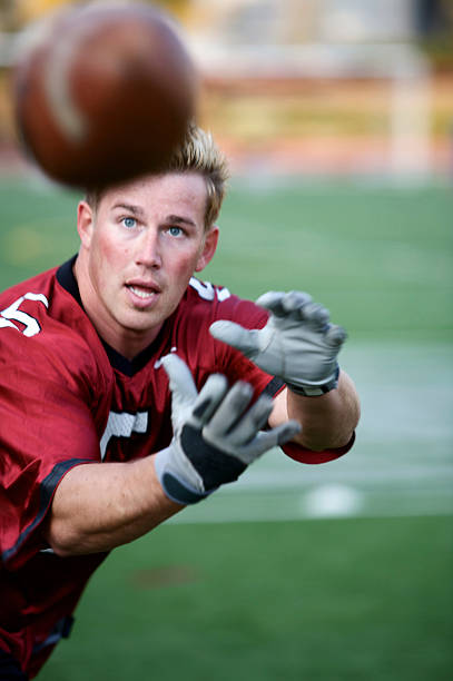 young strong attractive fit adult male athlete playing football (motion blur intentional)