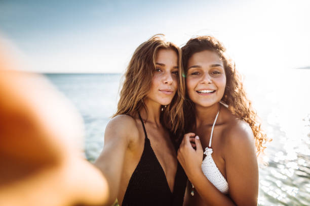 istock friends take a selfie at the beach 1151763570