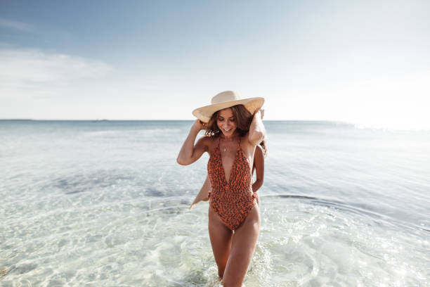 istock happiness friends at the seaside with panama hat 1151763796