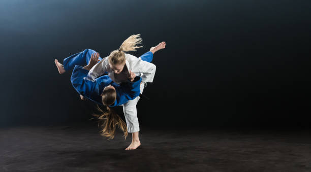 istock Female Judo Players Competing During Match 1151765823