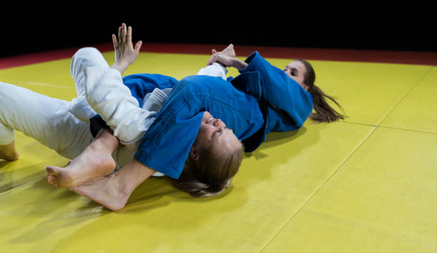 Female Judo Players Competing During Match