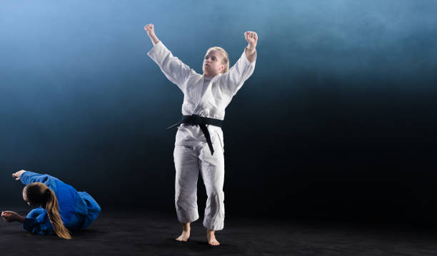 istock Female Judo Player Winning Judo Match 1151765856