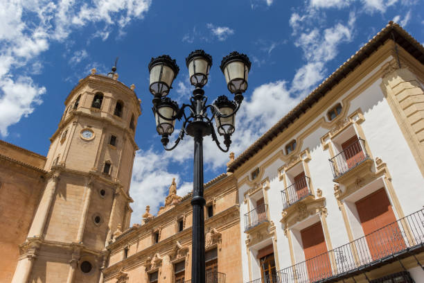 Street light and tower of the San Patricio church in Lorca Street light and tower of the San Patricio church in Lorca, Spain lorca stock pictures, royalty-free photos & images