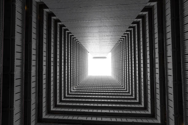 istock Abstract building facade concrete void or tunnel with natural light in the end / architecture design / abstract concept / background texture 1151766210