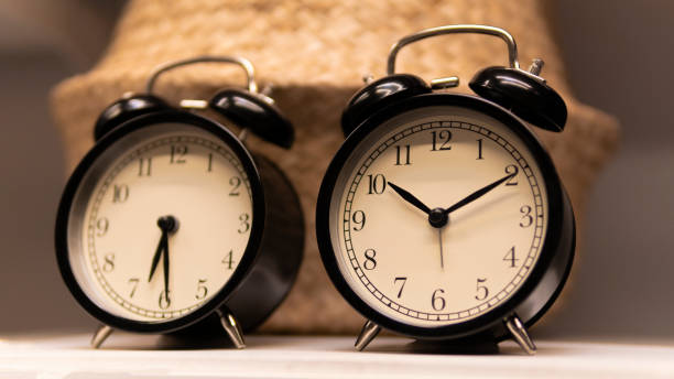 istock black desk clock on the shelf 1151766317