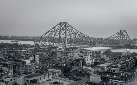Aerial View of Famous Howrah bridge/ Rabindra Setu along with cityscape of Kolkata City. Vintage effect is used.