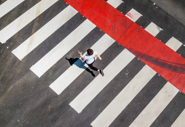 Woman Running Through a Zebra Crossing