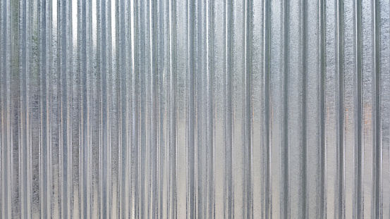 White Corrugated metal or zinc texture surface or galvanize steel in the vertical line background or texture