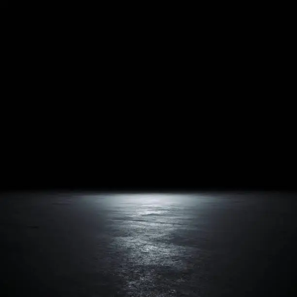 Photo of Empty spot lit dark background