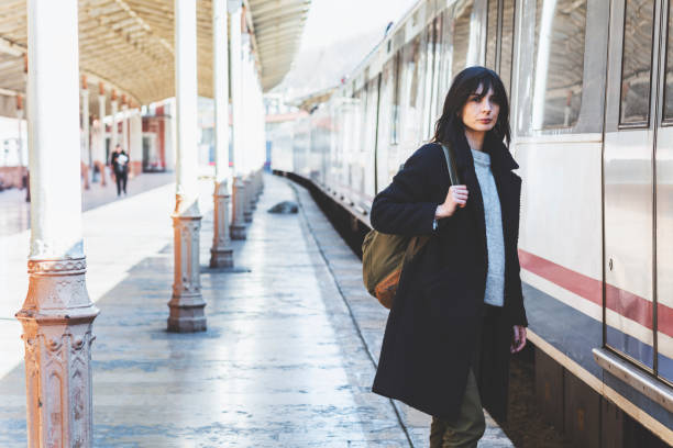 istock Young Woman Waiting For Someone On Train Station 1151771693