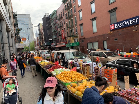 New York- 11 May 2019- unidentified Chinese sell the food on the street . it is home to the highest concentration of Chinese people in the Western Hemisphere.