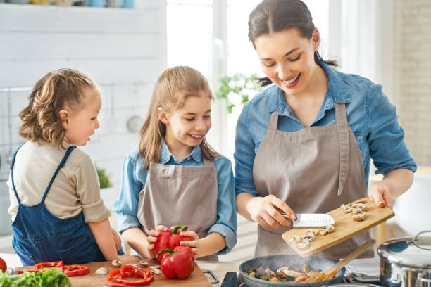 istock Happy family in the kitchen. 1151772845