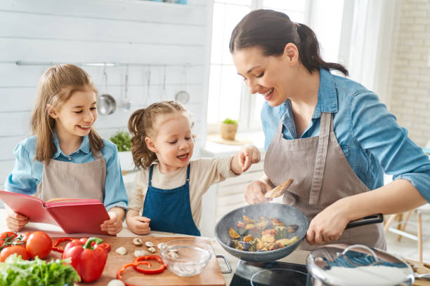 istock Happy family in the kitchen. 1151772858