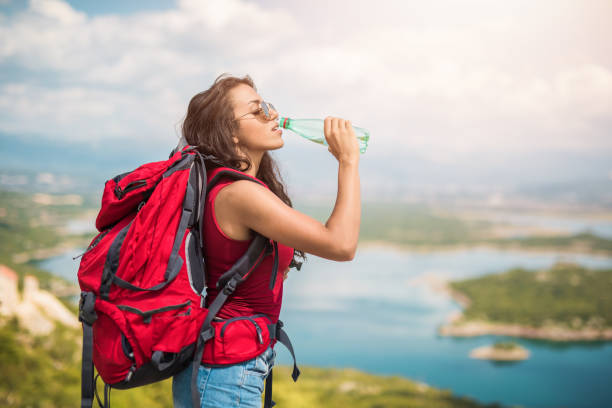 istock Young woman drinking water. 1151774536