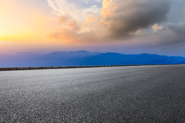 Asphalt highway road and beautiful huangshan mountains nature landscape Asphalt highway road and beautiful huangshan mountains nature landscape at sunrise huangshan mountains stock pictures, royalty-free photos & images