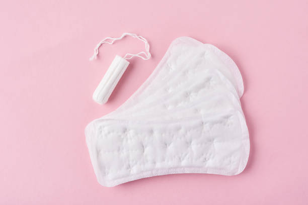 istock Sanitary pad and menstrual tampon on a pink background 1151775827