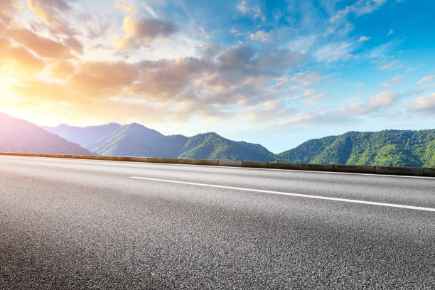 istock Highway road and beautiful mountain with clouds landscape 1151775969