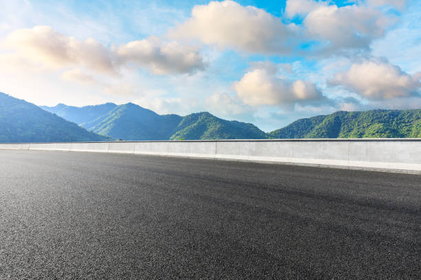 istock Highway road and beautiful mountain with clouds landscape 1151776001
