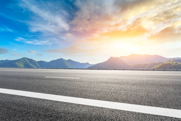 istock Highway road and beautiful mountain with clouds landscape 1151776062