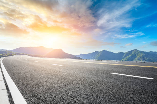 istock Highway road and beautiful mountain with clouds landscape 1151776158