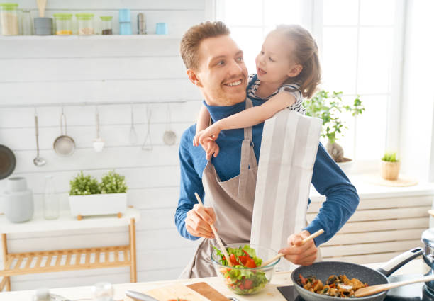 istock Happy family in the kitchen. 1151776796