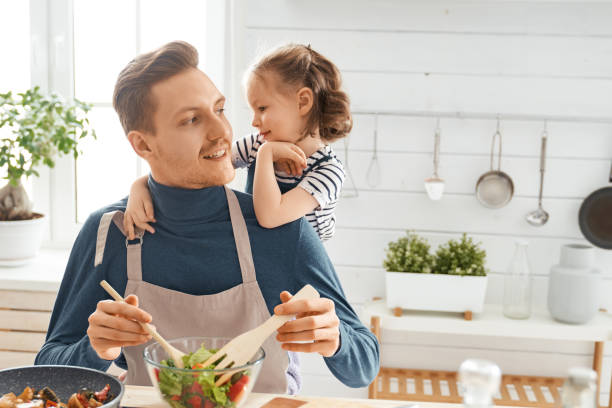 istock Happy family in the kitchen. 1151776800