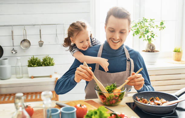 istock Happy family in the kitchen. 1151776803