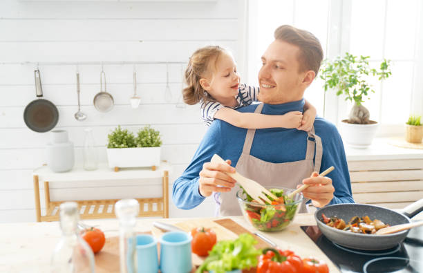 istock Happy family in the kitchen. 1151776807
