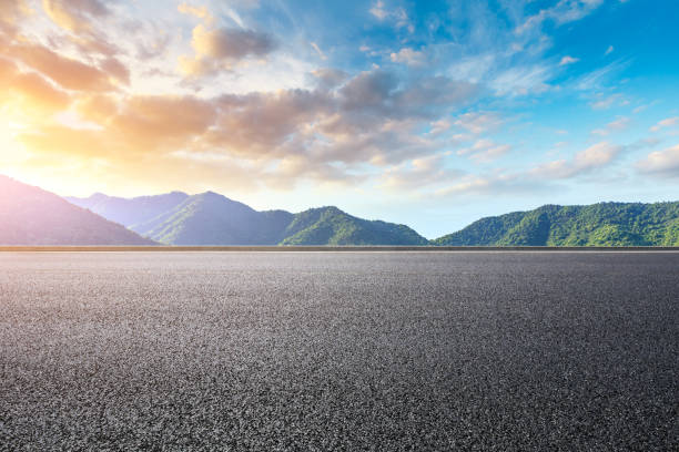 istock Asphalt road and beautiful mountain with clouds landscape 1151776809