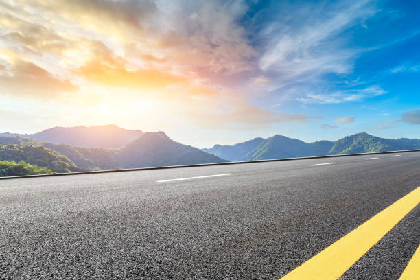 istock Highway road and beautiful mountain with clouds landscape 1151776830