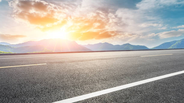 istock Highway road and beautiful mountain with clouds landscape 1151777734