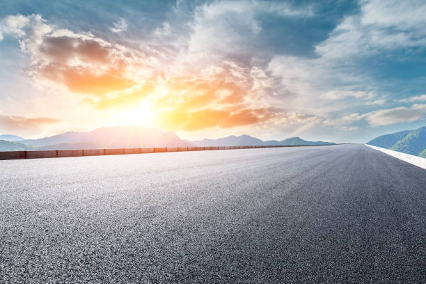 istock Highway road and beautiful mountain with clouds landscape 1151777748