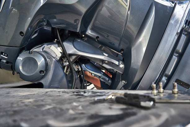 istock mechanic mounting big motor boat 1151780681