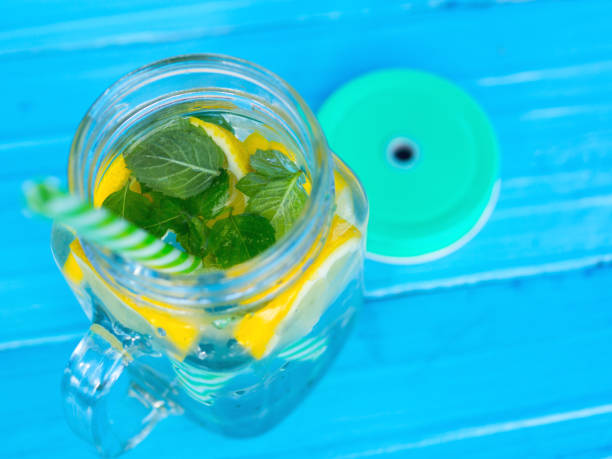 istock Lemonade with lemon and mint in a glass jar 1151781590