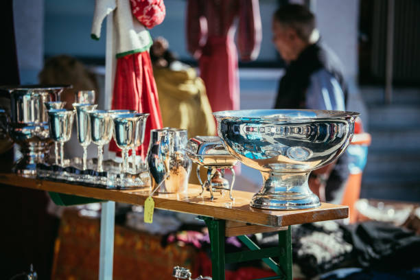 istock Flea market: Dishes and dinnerware in the foreground, people in the blurry background 1151784180