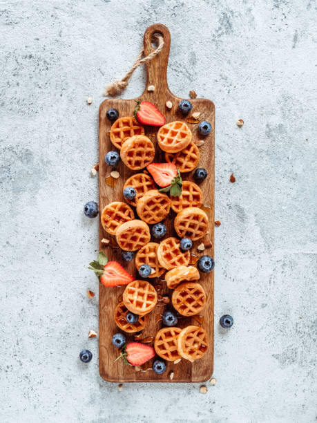 istock Delicious belgian waffles with berries, copy space 1151785678